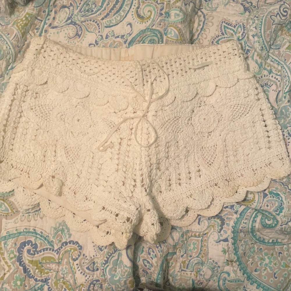 small boutique lace shorts. slight stain in front bottom- minimal